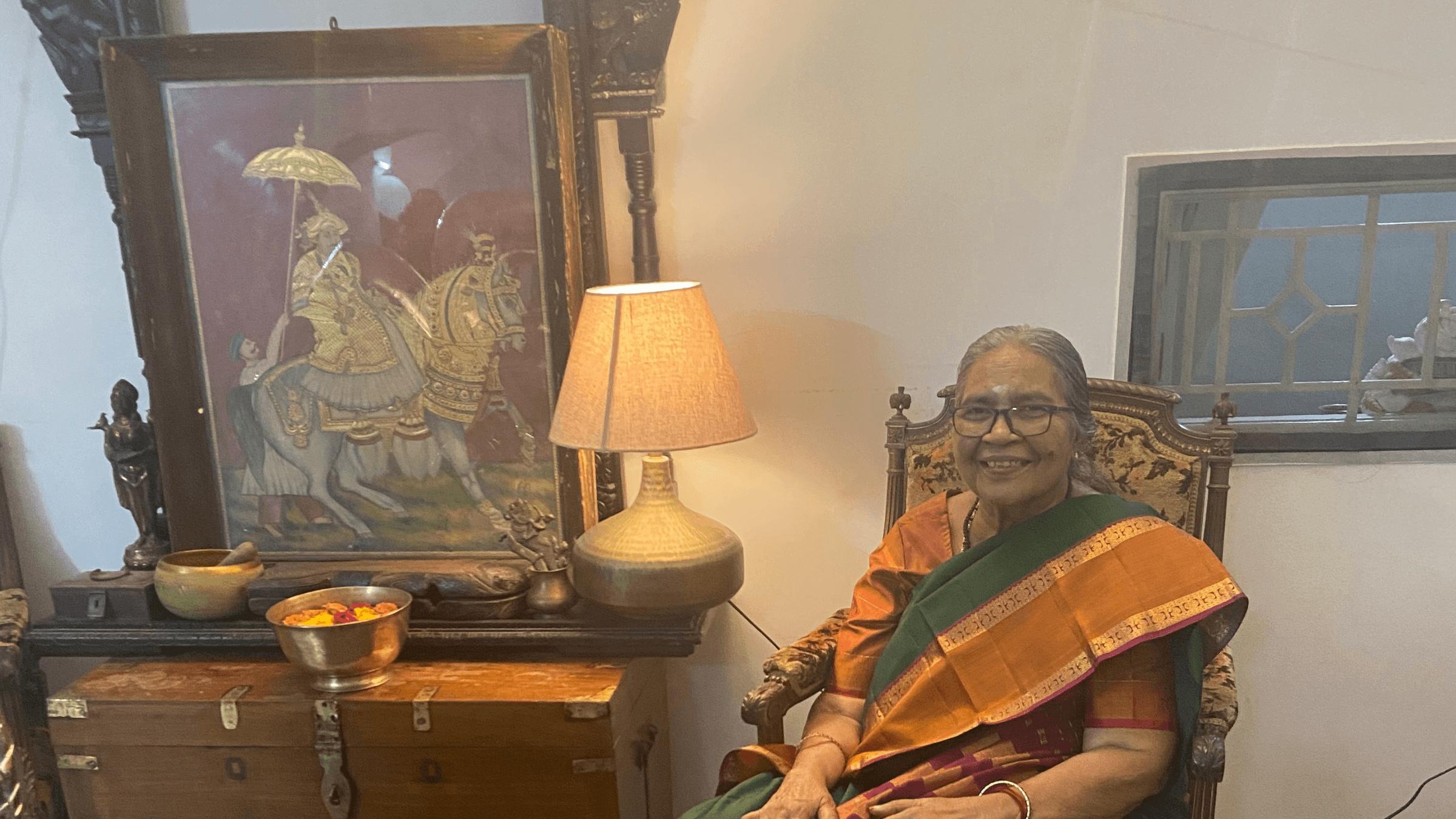 Image of my grandmother with a tanjore painting 