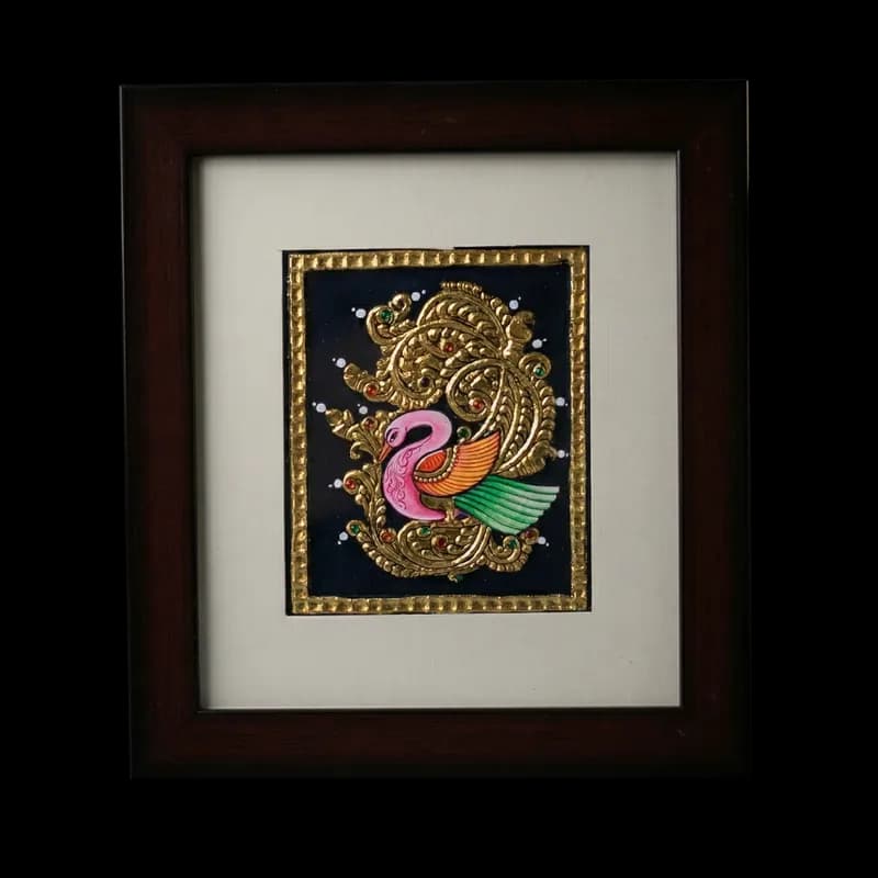 Hand-painted traditional Swan (Hamsa) Tanjore painting with 22K gold foil and semi-precious stones on a black background in a dark wood frame.