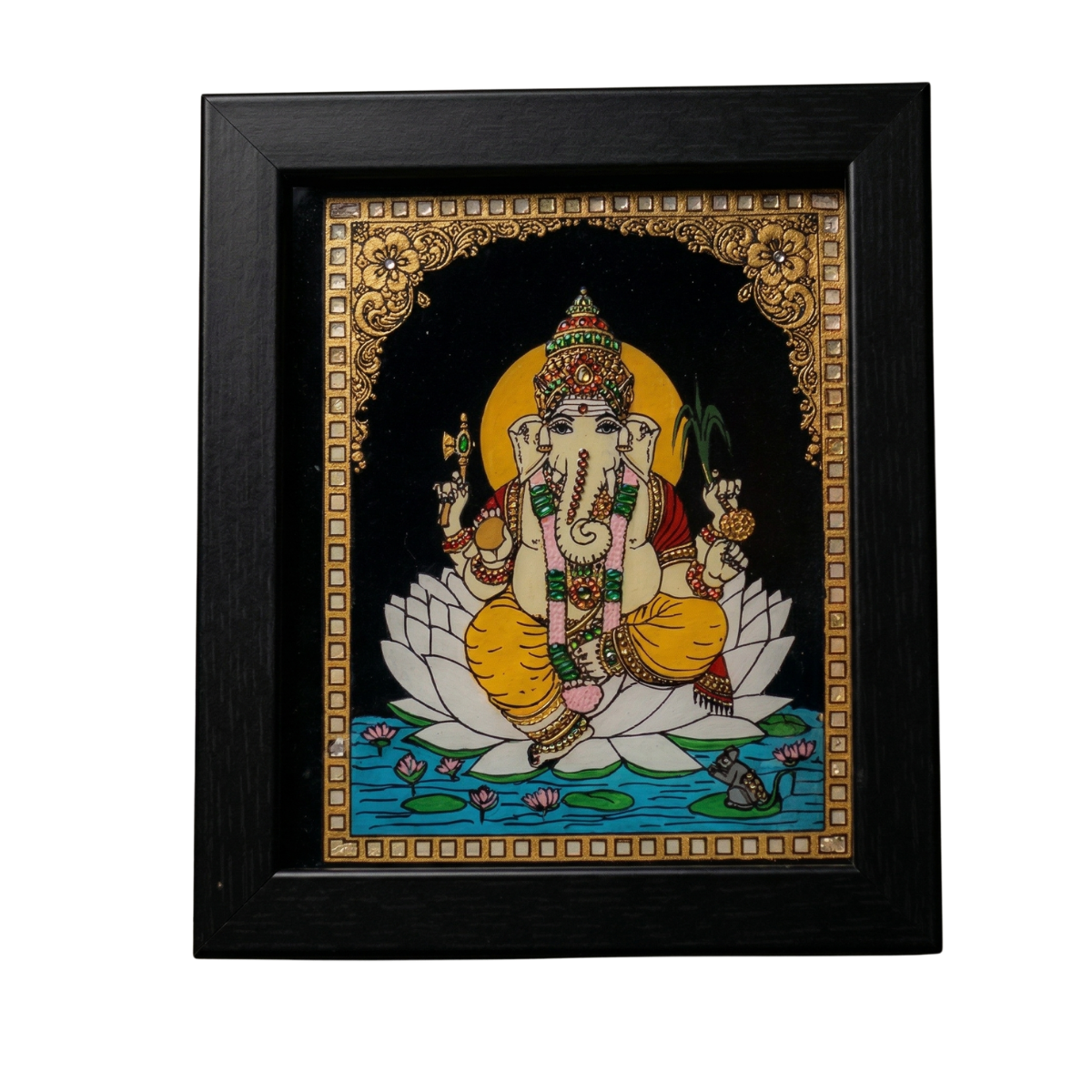 Handmade Lord Ganesha reverse glass painting by Shree Jai Arts. The Hindu deity is beautifully painted sitting on a white lotus in a pond with intricate gold detailing, encased in a premium black frame.